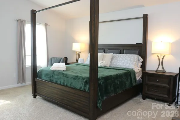 a bedroom with a bed and a closet