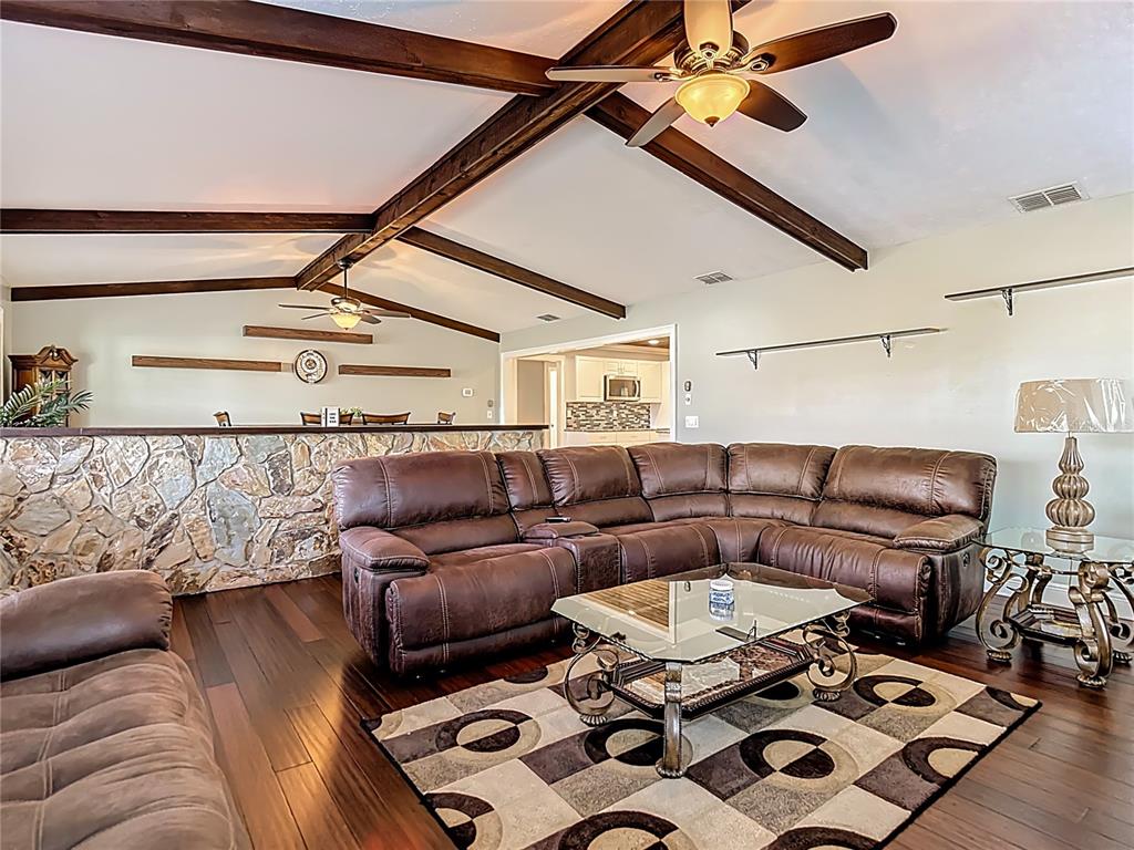 5904 Springrun Court Holiday, FL 34690 - Photo 11 of 79 a living room with furniture and wooden floor