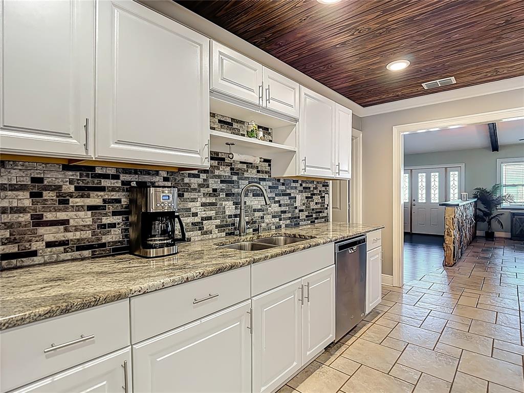5904 Springrun Court Holiday, FL 34690 - Photo 26 of 79 a kitchen with sink and cabinets