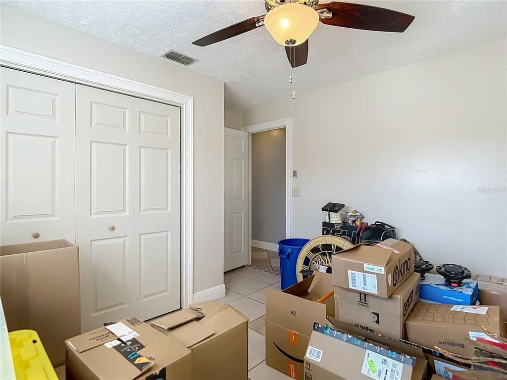 5904 Springrun Court Holiday, FL 34690 - Photo 39 of 79 a bed room with a bed and a window