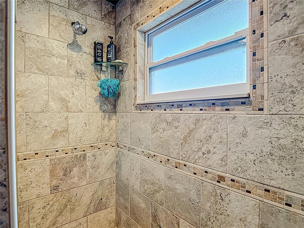 5904 Springrun Court Holiday, FL 34690 - Photo 47 of 79 a bathroom with a shower