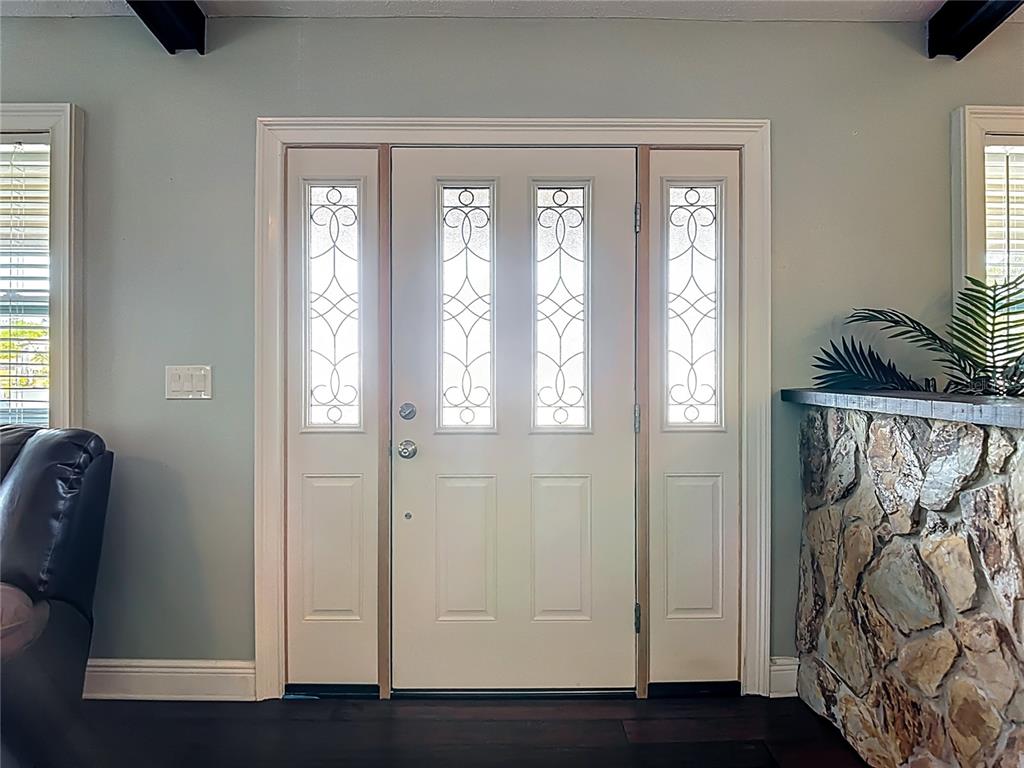 5904 Springrun Court Holiday, FL 34690 - Photo 9 of 79 a view of front door with wooden floor