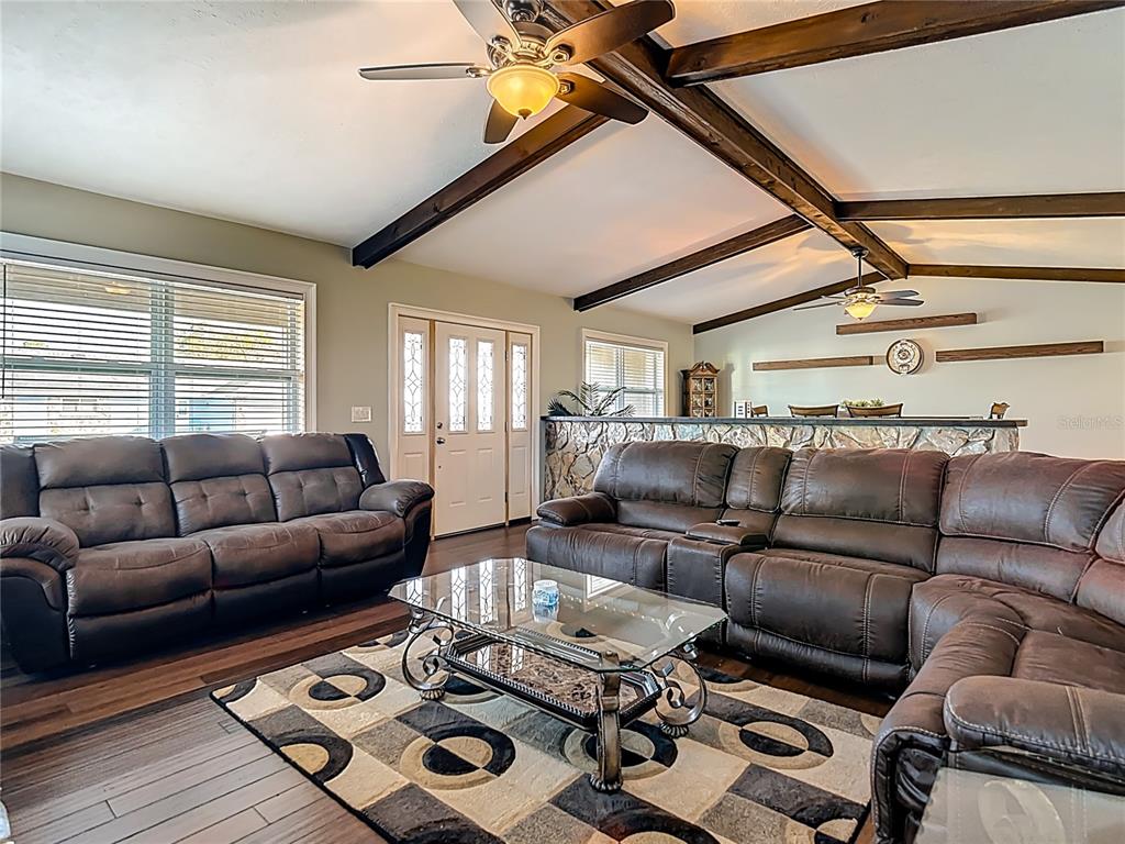 5904 Springrun Court Holiday, FL 34690 - Photo 10 of 79 a living room with furniture a rug and a window