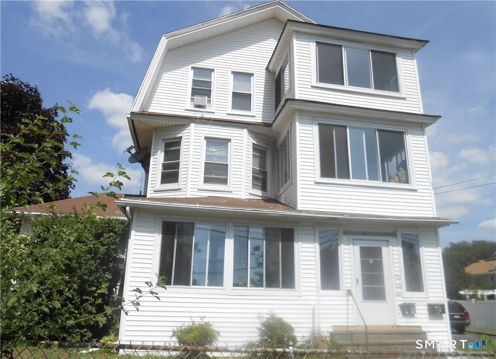 166 Booth Street Stratford, CT 06614 - Photo 2 of 12 a view of a white building