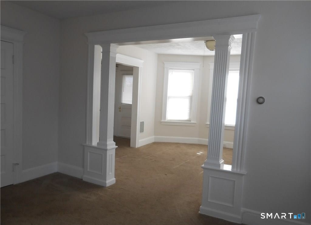 166 Booth Street Stratford, CT 06614 - Photo 6 of 12 an empty room with windows