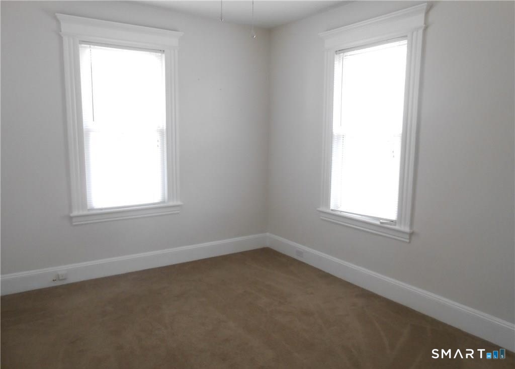 166 Booth Street Stratford, CT 06614 - Photo 10 of 12 an empty room with a window