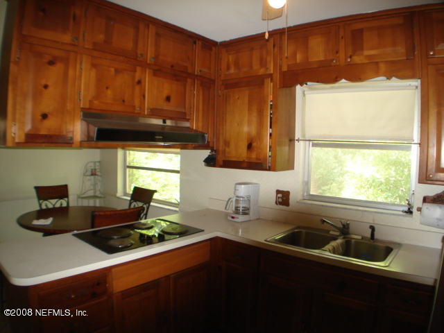 1010 Ald Road Jacksonville, FL 32211 - Photo 6 of 13 KITCHEN WITH BUILT IN DESK AREA