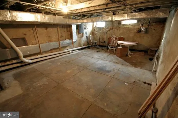 a white toilet sitting next to a bathroom sink