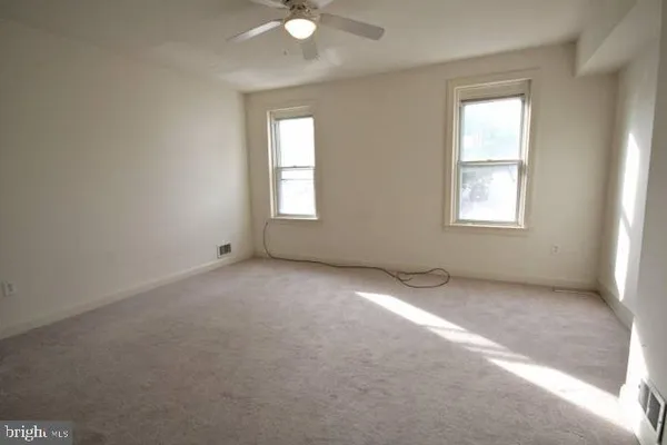 a white toilet sitting next to a sink