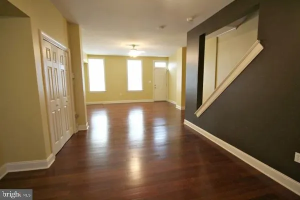 a view of an entryway with wooden floor