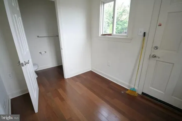 a white toilet sitting next to a sink