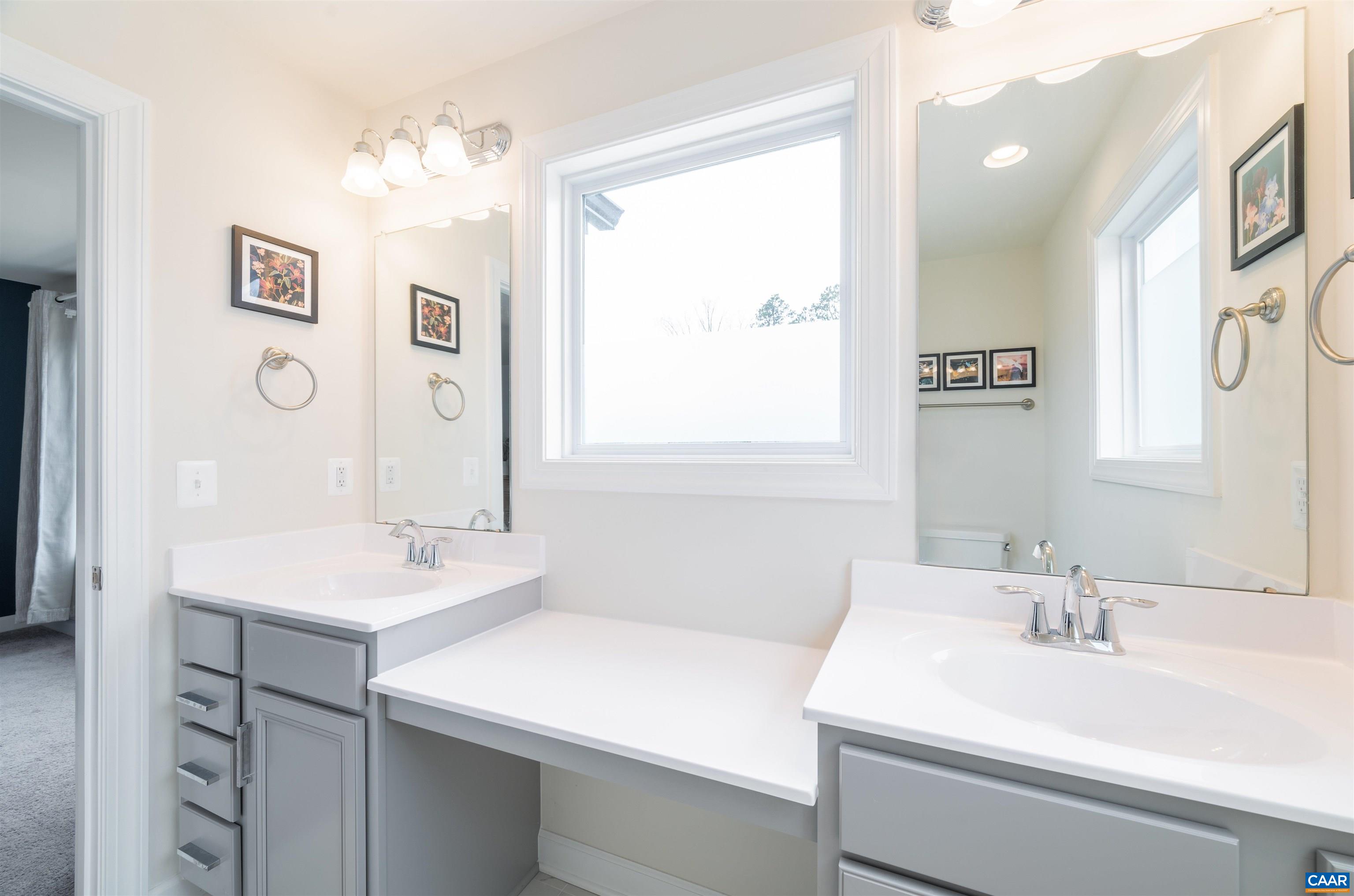 3171 Horizon Road Charlottesville, VA 22902 - Photo 34 of 45 a bathroom with a sink vanity and a mirror