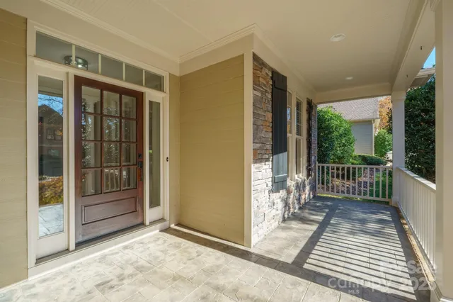 a view of a porch with wooden floor and outdoor space