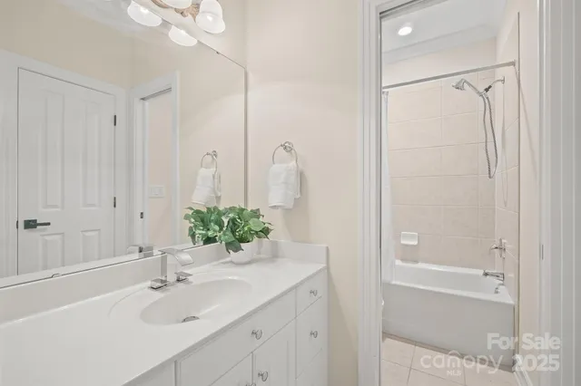 a bathroom with a sink tub and shower