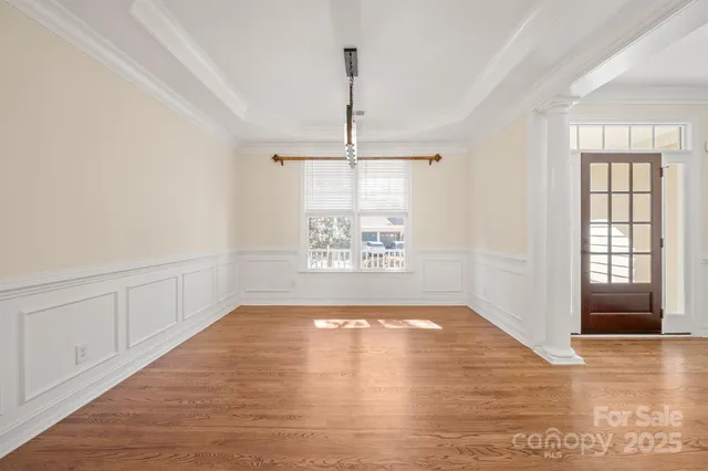 an empty room with windows and entrance