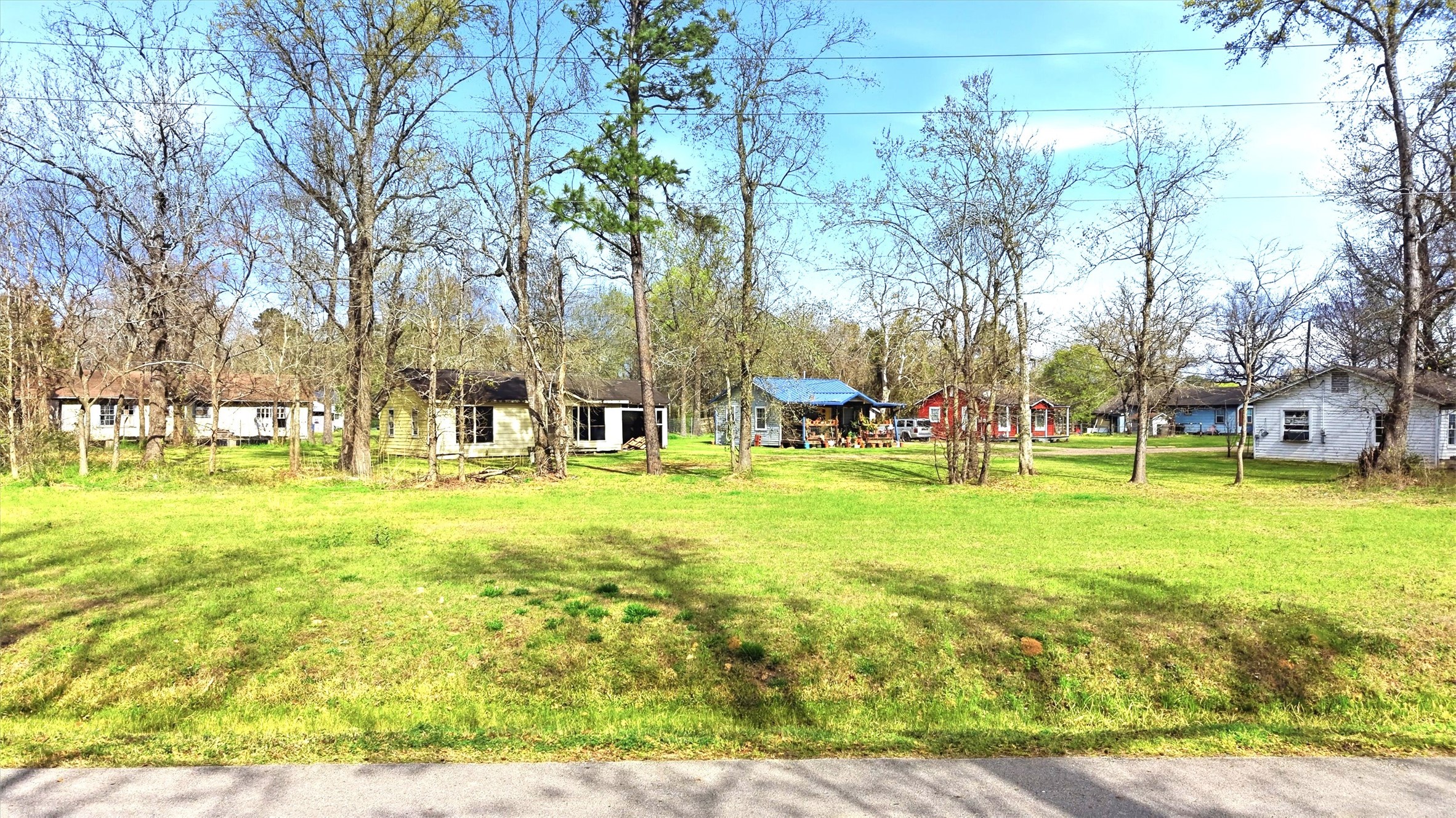 2636 Clanton Road Conroe, TX 77301 - Photo 17 of 20 a view of yard with swimming pool and green space