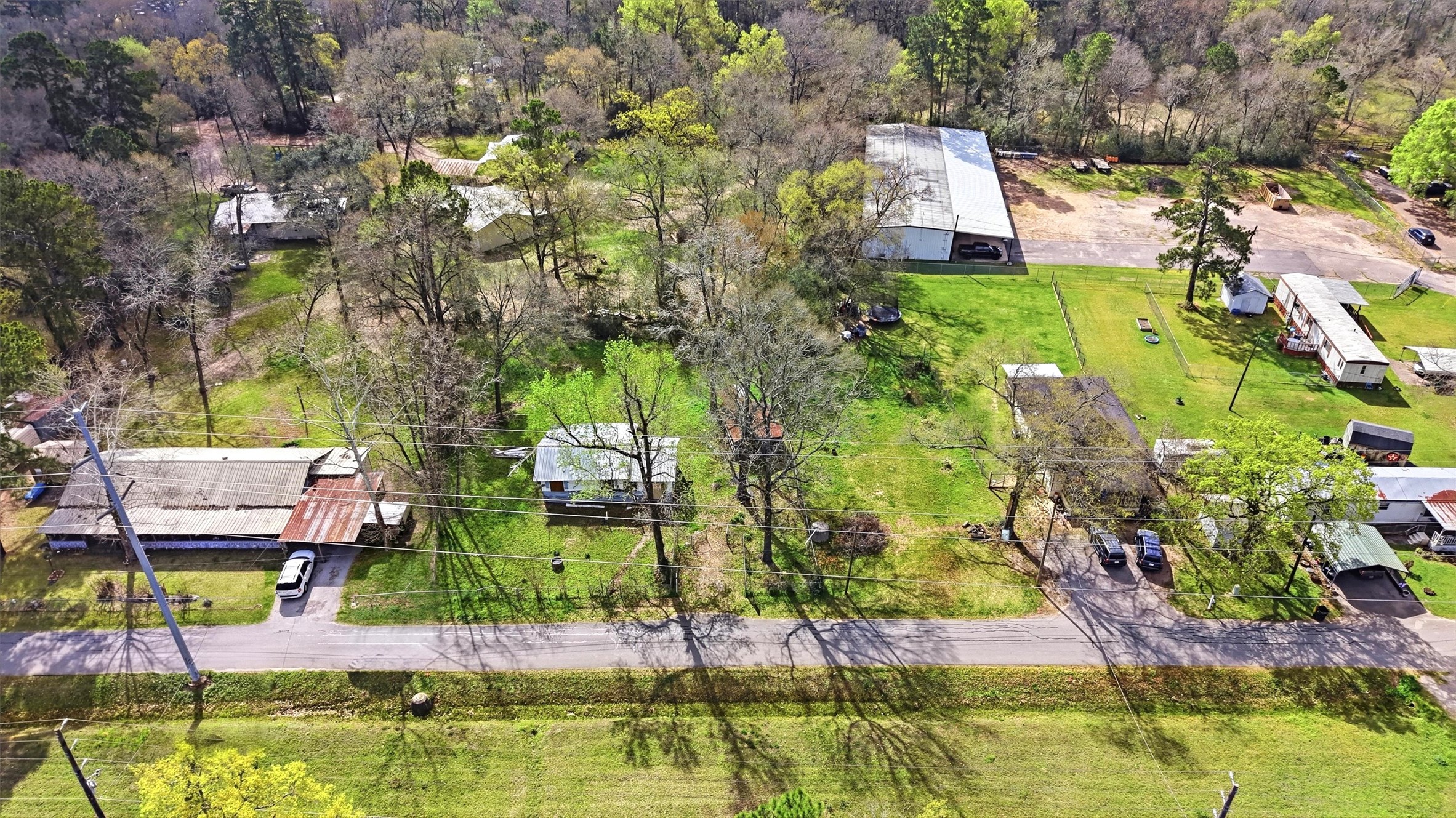 2636 Clanton Road Conroe, TX 77301 - Photo 2 of 20 an aerial view of residential houses with outdoor space and swimming pool