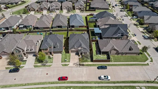 an aerial view of house with yard
