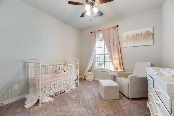 a bedroom with furniture and windows