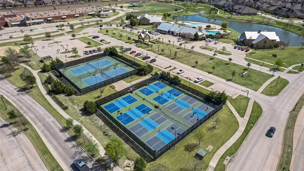an aerial view of residential houses with outdoor space