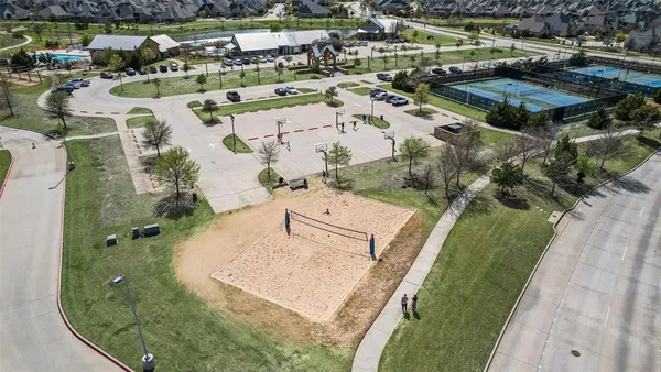 an aerial view of a house with swimming pool and outdoor space
