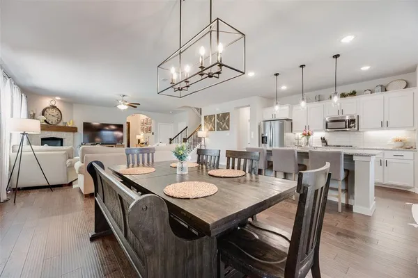 a view of a dining room and livingroom with furniture