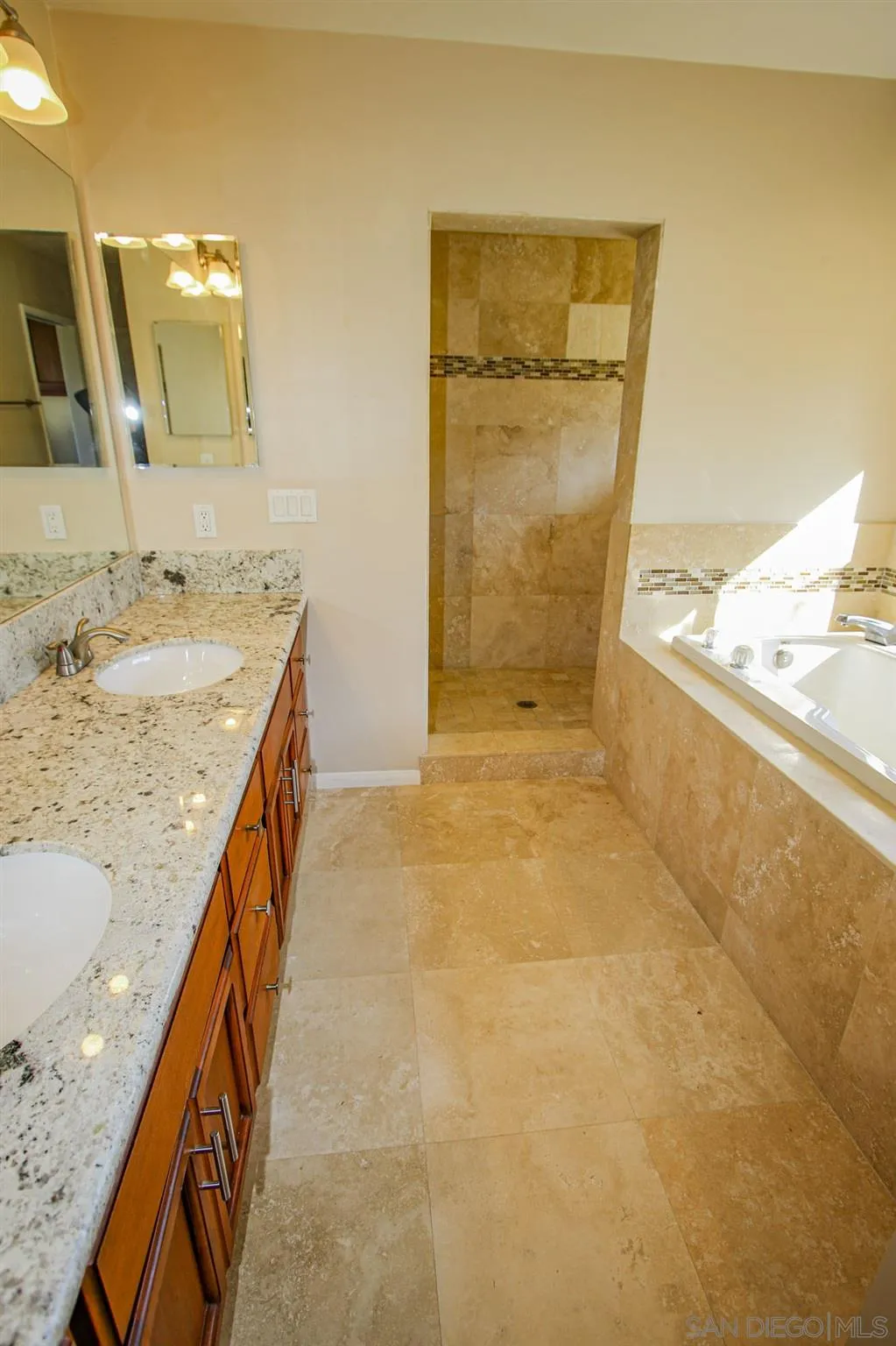 28620 Gordon Hill Road Valley Center, CA 92082 - Photo 8 of 15 a bathroom with a granite countertop sink and a mirror