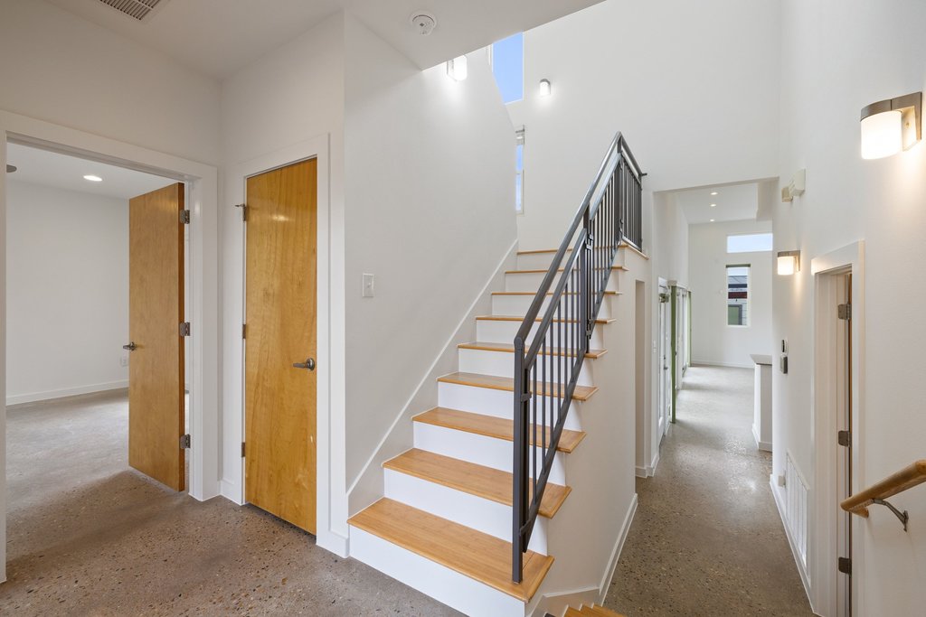 7412 Ava Lane Austin, TX 78724 - Photo 21 of 28 Stairway with a high ceiling and recessed lighting