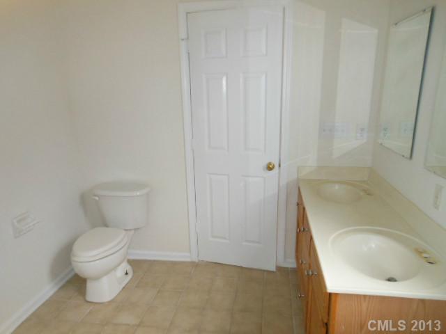 4513 Hyperion Court Charlotte, NC 28216 - Photo 13 of 16 a bathroom with a sink and a toilet