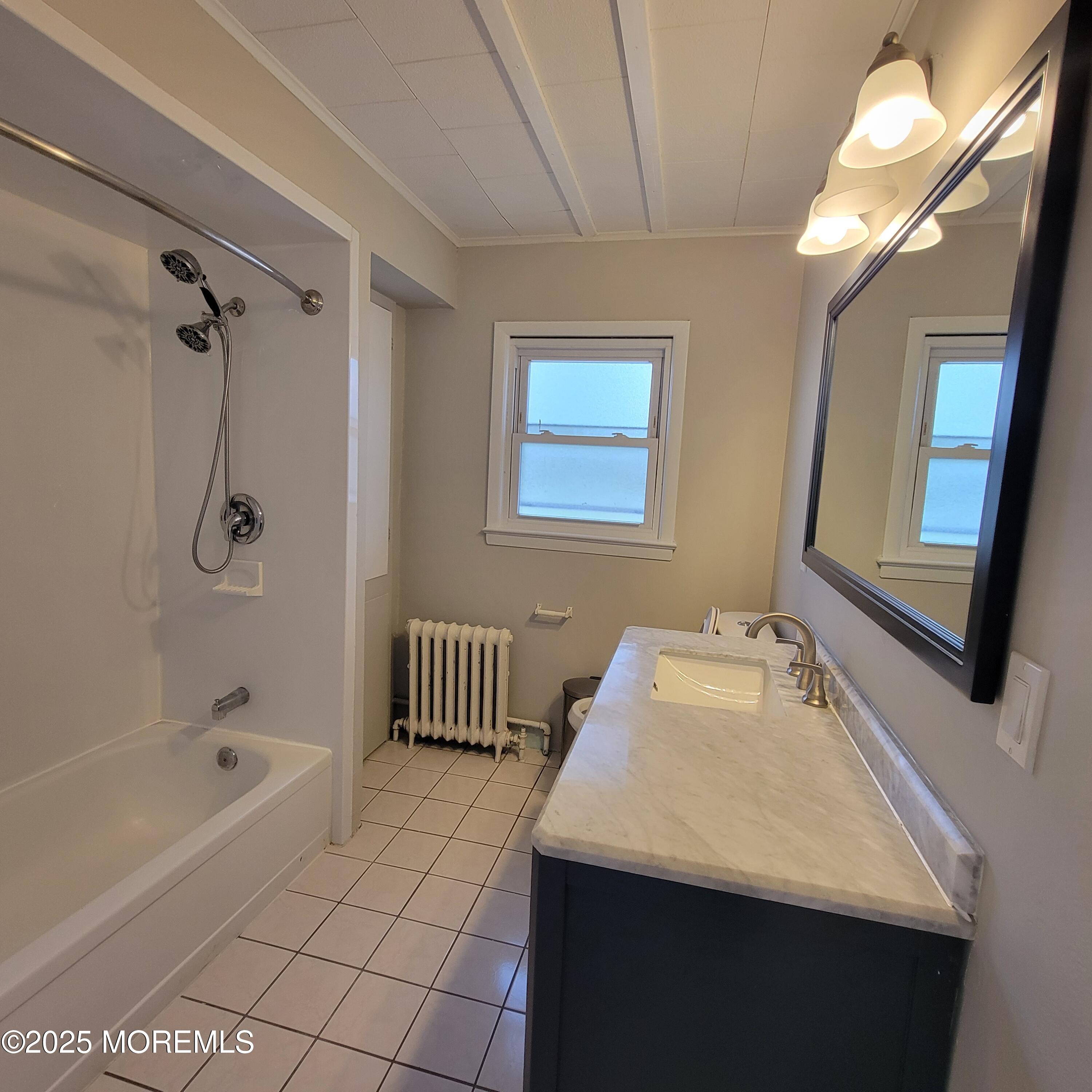 100 3rd Street Keyport, NJ 07735 - Photo 12 of 14 a bathroom with a sink a toilet and shower