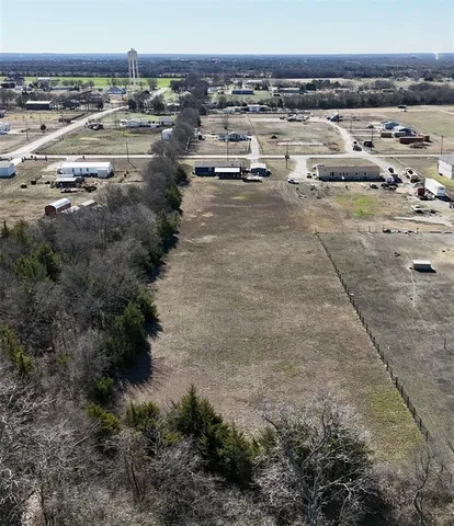 a kitchen with a sink a counter top space stainless steel appliances and cabinets