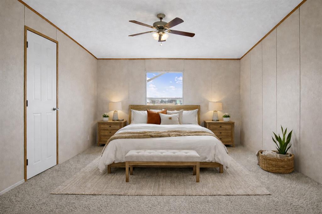 242 Private Road 4732 Rhome, TX 76078 - Photo 15 of 33 a bedroom with a bed and a potted plant