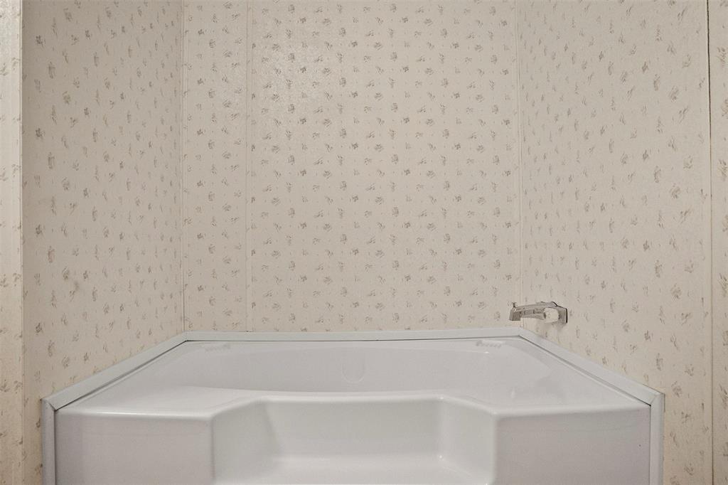 242 Private Road 4732 Rhome, TX 76078 - Photo 18 of 33 a close up of a bathtub