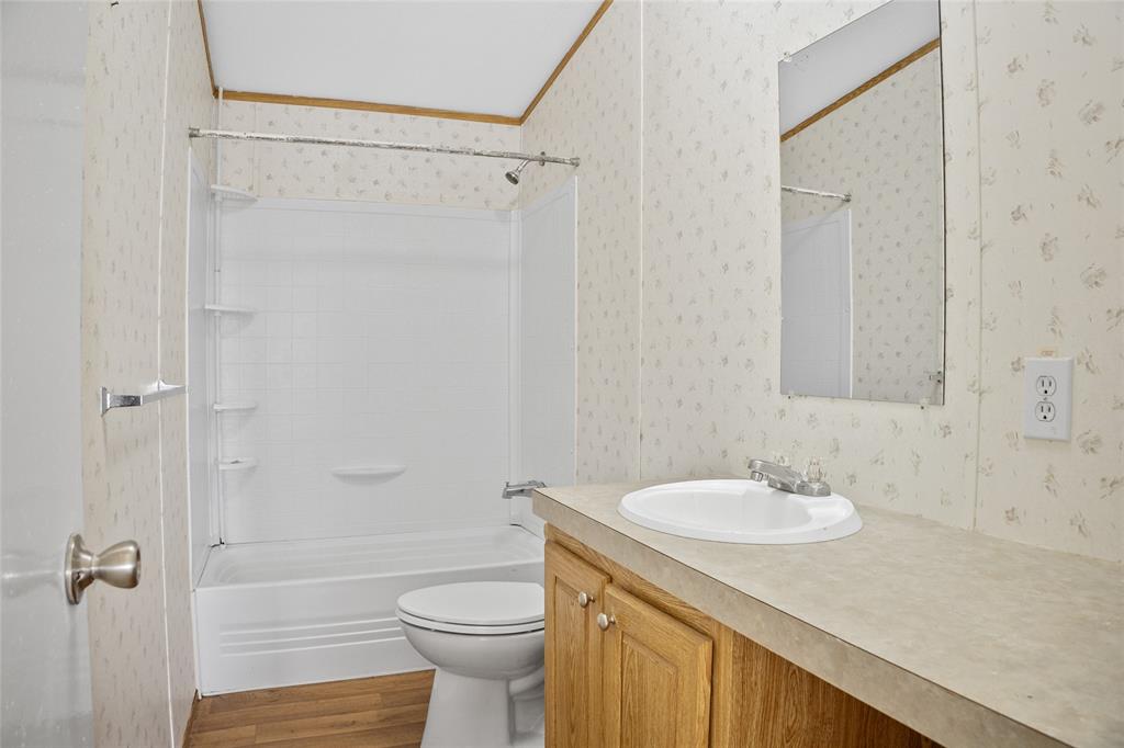 242 Private Road 4732 Rhome, TX 76078 - Photo 20 of 33 a bathroom with a sink toilet and shower