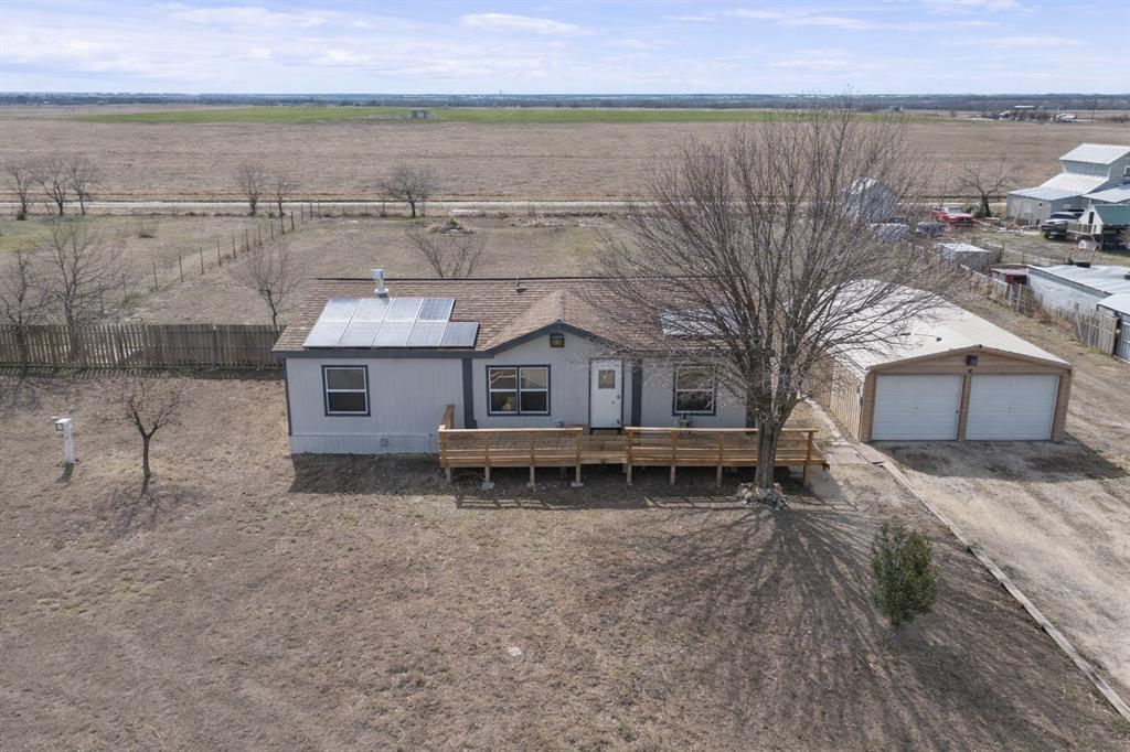 242 Private Road 4732 Rhome, TX 76078 - Photo 2 of 33 a house with a outdoor space