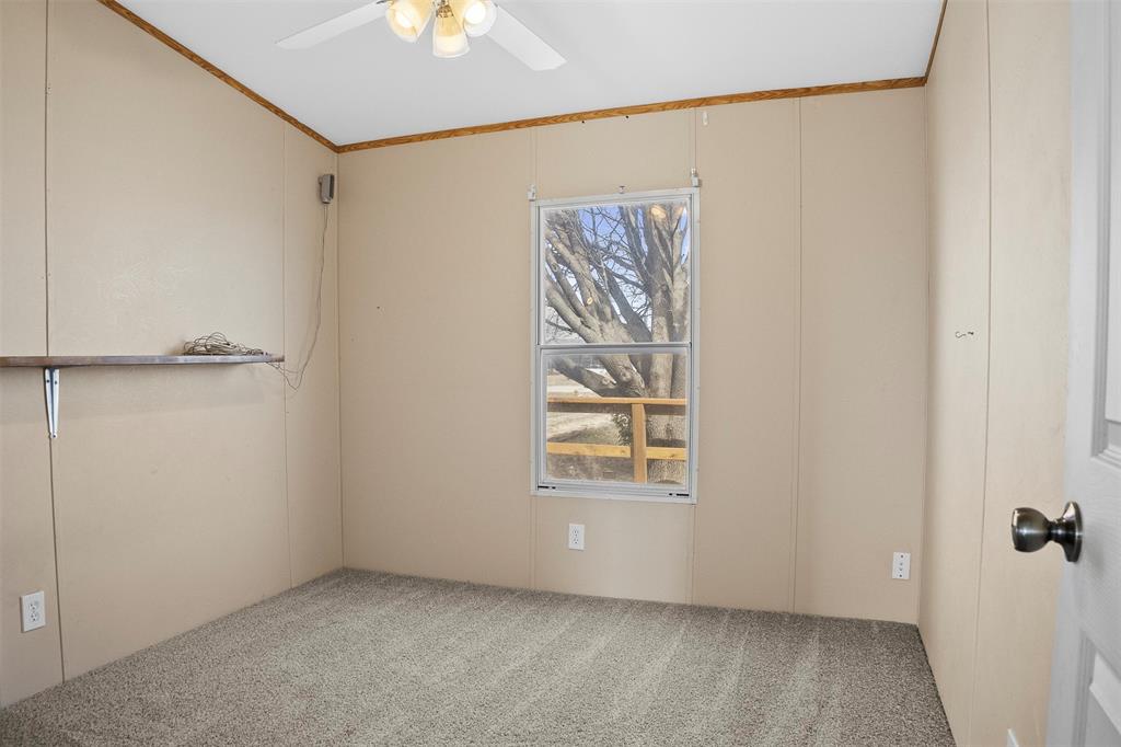 242 Private Road 4732 Rhome, TX 76078 - Photo 23 of 33 an empty room with windows and closet