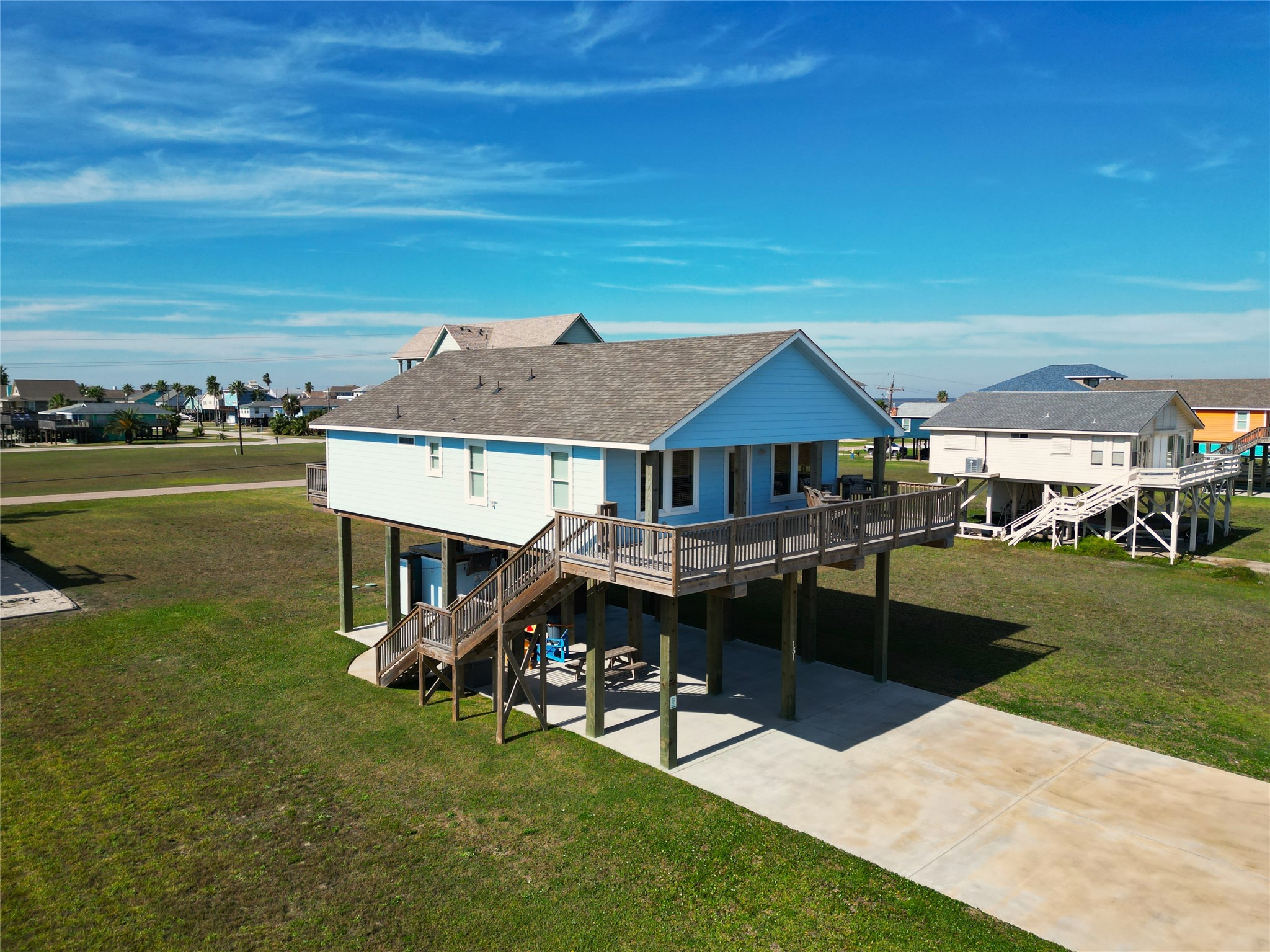 131 Pieces Of 8 Freeport, TX 77541 - Photo 6 of 43 a front view of a house with a garden