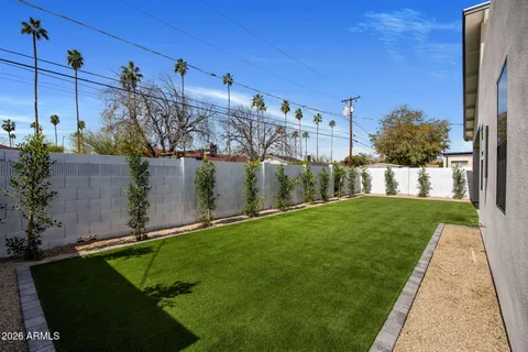 a view of a house with swimming pool and sitting area