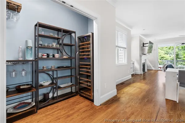 a bedroom with a bed and a mirror