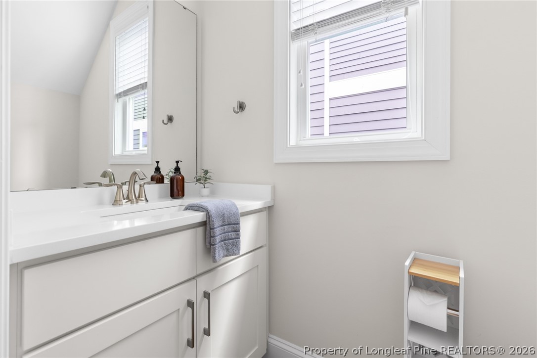 398 Carolina Avenue Raleigh, NC 27606 - Photo 19 of 50 a bathroom with a sink and a vanity