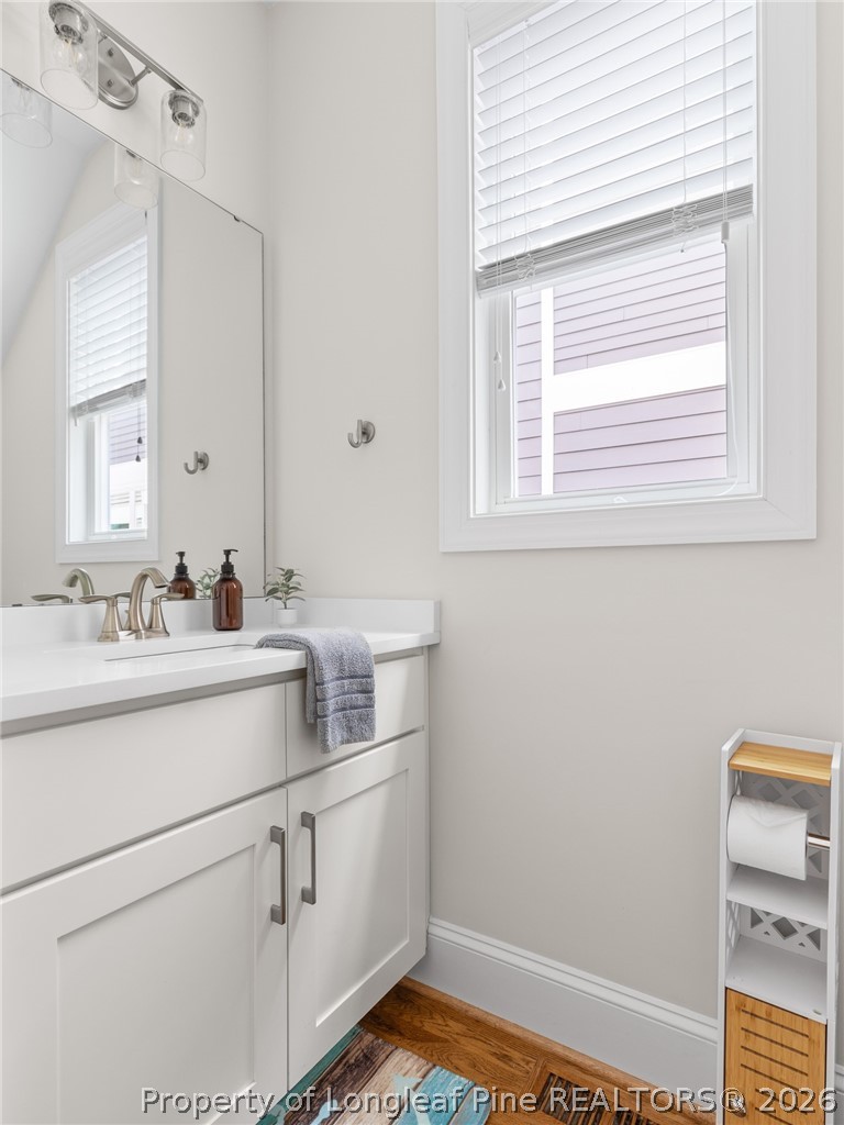 398 Carolina Avenue Raleigh, NC 27606 - Photo 20 of 50 a bathroom with a sink and a window