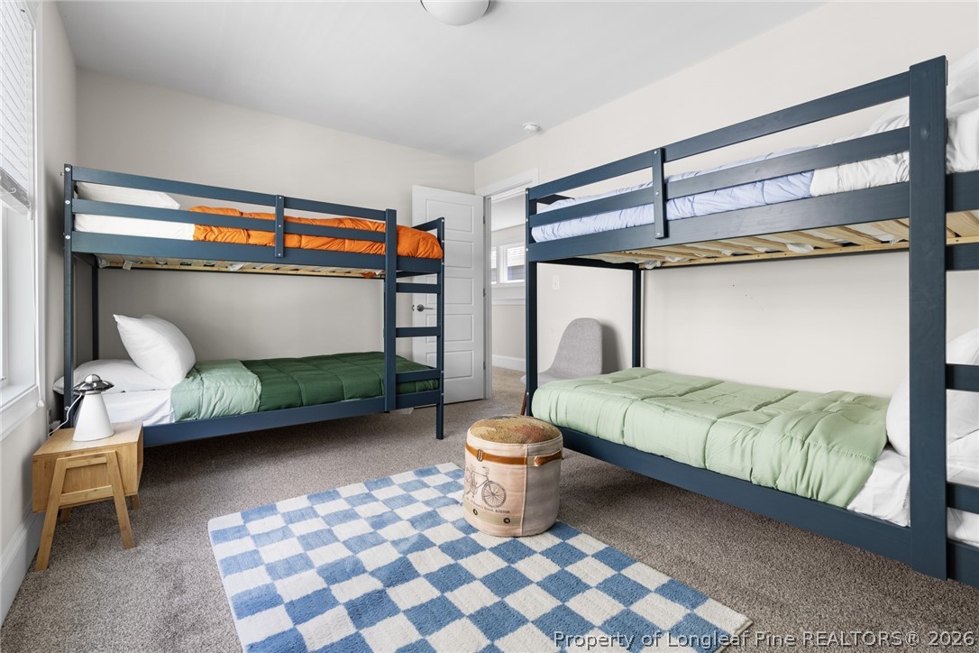 398 Carolina Avenue Raleigh, NC 27606 - Photo 35 of 50 a bedroom with a bed and a window