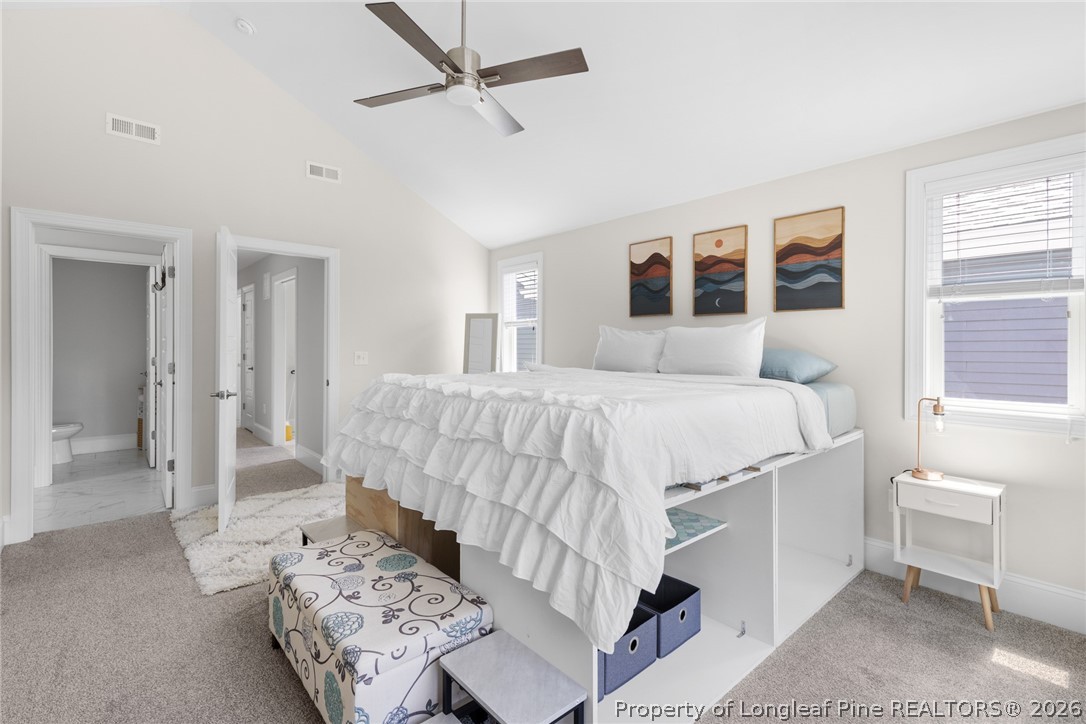 398 Carolina Avenue Raleigh, NC 27606 - Photo 38 of 50 a bedroom with a large bed and a window