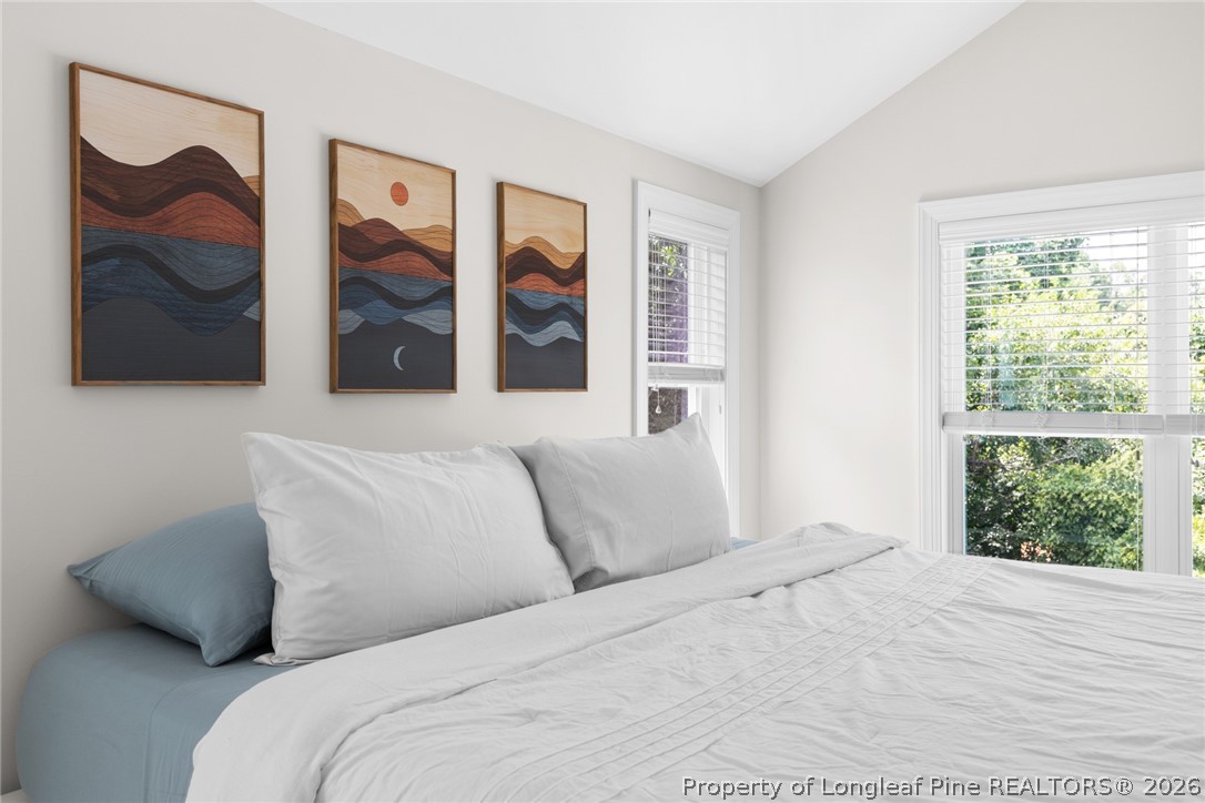 398 Carolina Avenue Raleigh, NC 27606 - Photo 39 of 50 a bedroom with a bed and a window