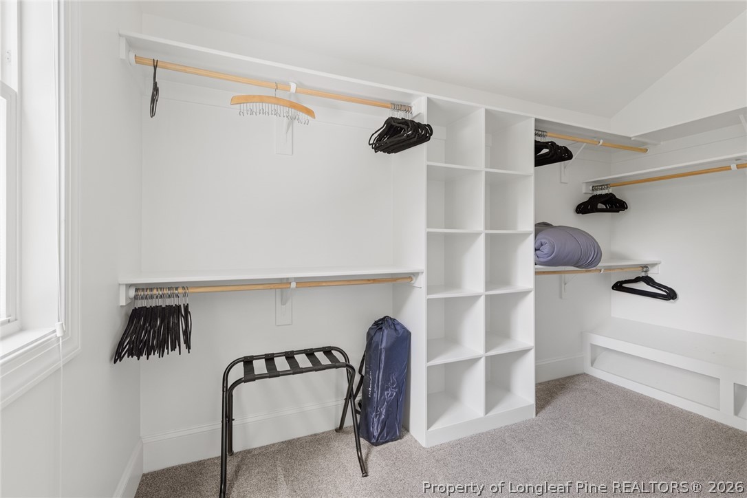 398 Carolina Avenue Raleigh, NC 27606 - Photo 40 of 50 a view of walk in closet with clothes and shoes