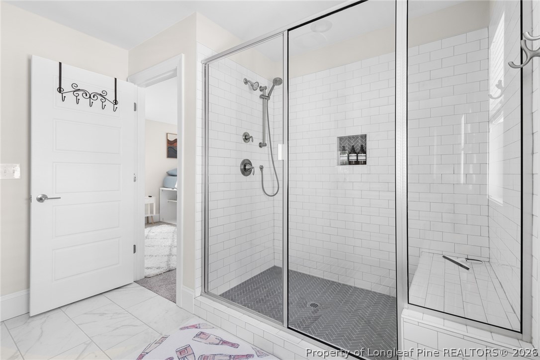 398 Carolina Avenue Raleigh, NC 27606 - Photo 42 of 50 a bathroom with a shower and a toilet