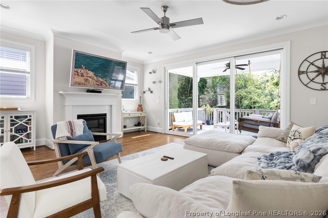 398 Carolina Avenue Raleigh, NC 27606 - Photo 6 of 50 a living room with furniture a large window and a fireplace