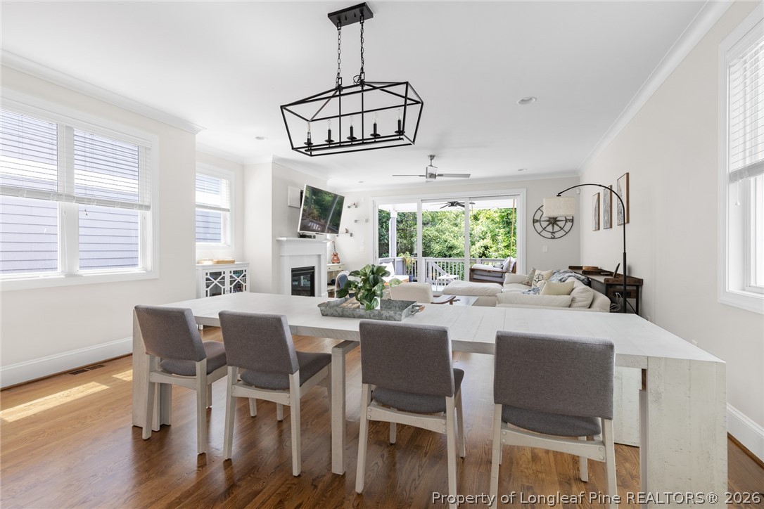 398 Carolina Avenue Raleigh, NC 27606 - Photo 10 of 50 a view of a dining room with furniture window and wooden floor