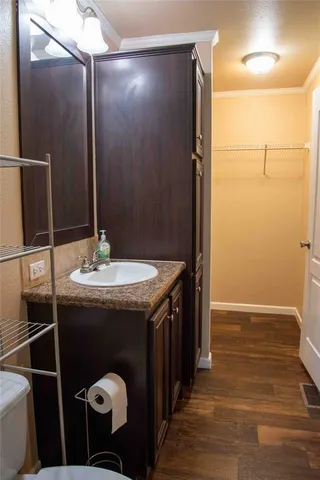 a bathroom with a sink and mirror