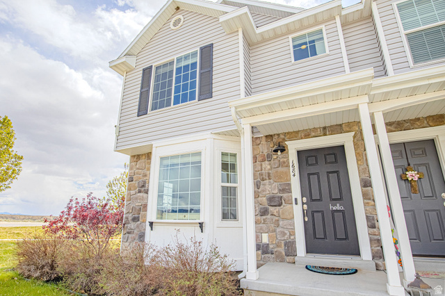 1684 Eastridge Road Price, UT 84501 - Photo 1 of 1 Doorway to property with stone siding and covered porch